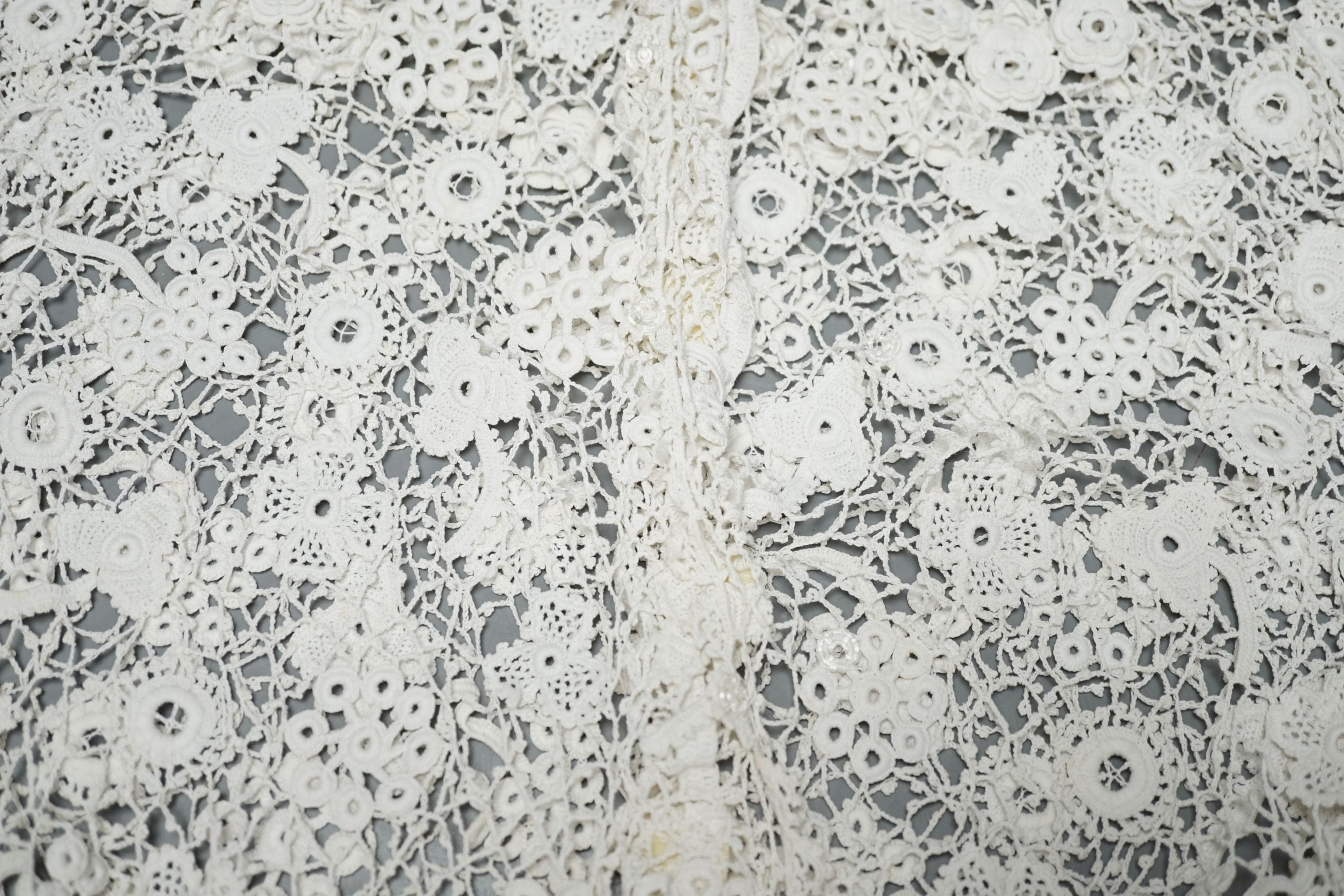 A 19th century hand made Irish crochet jacket, with long sleeves and high collar, a bobbin lace and white worked patch worked blouse, a fine lawn and anglaise worked blouse and a fine bobbin lace trimmed and white worked